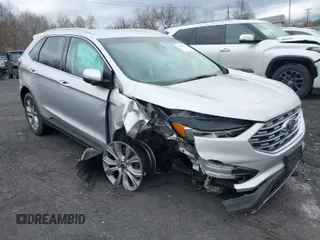 2019 Ford Edge Titanium with VIN 2FMPK4K95KBB55619, listed as a IAAI auction lot 42048941 with 89,999 mi miles. Bid and sale history available at carsss.com. Image 1.