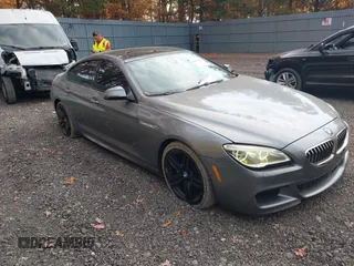 2016 BMW 6 Series 640i xDrive with VIN WBA6D2C50GGT66007, listed as a IAAI auction lot 40673899 with 73,695 mi miles and . Bid and sale history available at carsss.com. Image 1.