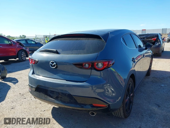 2023 Mazda 3 S Carbon Edition with VIN JM1BPBLM8P1611106, listed as a IAAI auction lot 42191902 with 37,244 mi miles and . Bid and sale history available at DreamBid. Image 4.