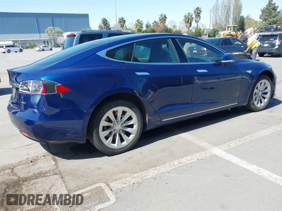 2016 Tesla Model S 90D with VIN 5YJSA1E25GF157220, listed as a IAAI auction lot 42003019 with 130,540 mi miles and . Bid and sale history available at DreamBid. Image 4.