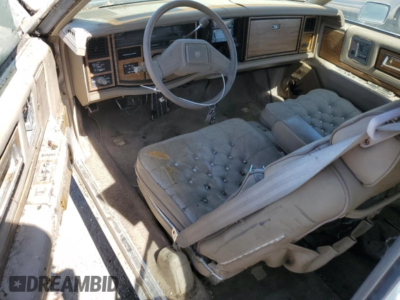 1985 Cadillac Eldorado z VIN 1G6EL578XFE661216, wystawiony jako Copart lot #54606984 z przebiegiem 12 462 mil mil oraz Szkoda całkowita • Salvage title. Historia ofert i sprzedaży dostępna na DreamBid. Obrazek 8.