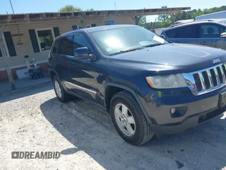 2012 Jeep Grand Cherokee Laredo with VIN 1C4RJEAG9CC223167, listed as a IAAI auction lot 42136098 with 152,715 mi miles. Bid and sale history available at carsss.com. Image 1.