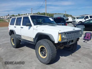 1991 Jeep Cherokee z VIN 1J4FJ88S6ML515949, wystawiony jako IAAI lot #41926218 z przebiegiem 222 976 mil mil oraz . Historia ofert i sprzedaży dostępna na DreamBid. Obrazek 1.
