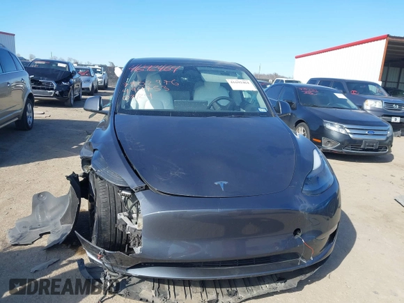 2022 Tesla Model Y Performance z VIN 7SAYGDEF8NF494753, wystawiony jako IAAI lot #41692464 z przebiegiem 14 616 mil mil oraz . Historia ofert i sprzedaży dostępna na DreamBid. Obrazek 12.