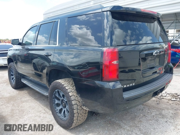2018 Chevrolet Tahoe LT with VIN 1GNSCBKC9JR133640, listed as a IAAI auction lot 42542381 with 130,154 mi miles and . Bid and sale history available at DreamBid. Image 3.