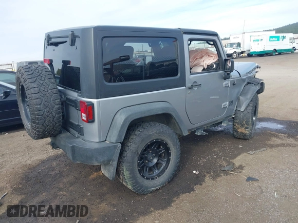 2013 Jeep Wrangler Rubicon 10th Anniversary with VIN 1C4BJWCG8DL639121, listed as a IAAI auction lot 40561773 with 56,023 mi miles and . Bid and sale history available at DreamBid. Image 4.