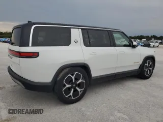 2023 Rivian R1S Adventure z VIN 7PDSGABA3PN024458, wystawiony jako Copart lot #74087714 z przebiegiem 3 505 mil mil oraz Nie do naprawy • Non repairable. Historia ofert i sprzedaży dostępna na DreamBid. Obrazek 3.