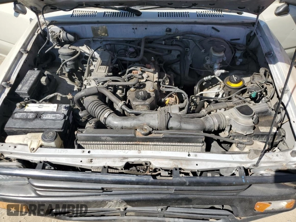 1992 Toyota Pickup z VIN JT4RN81A1N0094217, wystawiony jako Copart lot #56062545 z przebiegiem 242 256 mil mil oraz Szkoda całkowita • Salvage title. Historia ofert i sprzedaży dostępna na DreamBid. Obrazek 11.