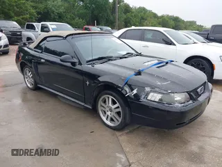 2002 Ford Mustang Deluxe z VIN 1FAFP44472F143656, wystawiony jako IAAI lot #42165457 z przebiegiem 143 548 mil mil oraz . Historia ofert i sprzedaży dostępna na DreamBid. Obrazek 1.