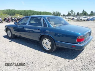 1996 Jaguar XJ with VIN SAJHX1740TC766425, listed as a IAAI auction lot 42758458 with 257,849 mi miles and . Bid and sale history available at DreamBid. Image 3.