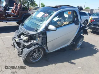2009 Smart fortwo Pure with VIN WMEEJ31X09K282711, listed as a IAAI auction lot 42164223 with Not provided miles and . Bid and sale history available at DreamBid. Image 2.