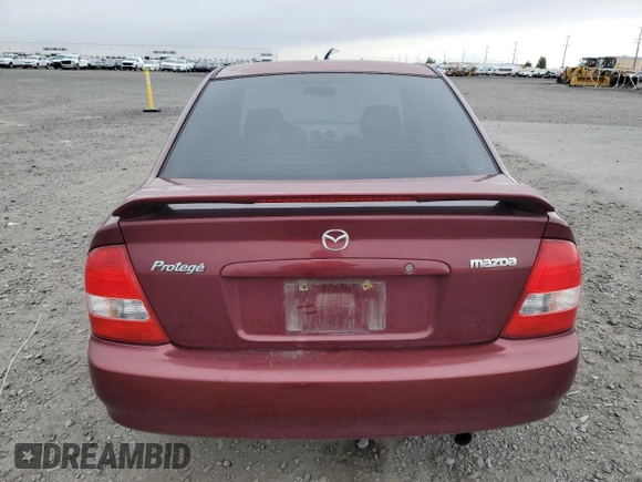 2002 Mazda Protege DX z VIN JM1BJ225320636991, wystawiony jako Copart lot #57915265 z przebiegiem 123 371 mil mil oraz Szkoda całkowita • Salvage title. Historia ofert i sprzedaży dostępna na DreamBid. Obrazek 6.