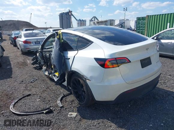 2023 Tesla Model Y Long Range with VIN 7SAYGDEE4PF780951, listed as a IAAI auction lot 41856461 with 63,317 mi miles. Bid and sale history available at carsss.com. Image 3.