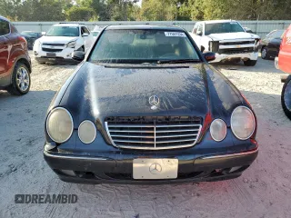 2002 Mercedes-Benz E-Class with VIN WDBJF65J32B494321, listed as a Copart auction lot 77557334 with 198,820 mi miles and Salvage Title. Bid and sale history available at carsss.com. Image 5.