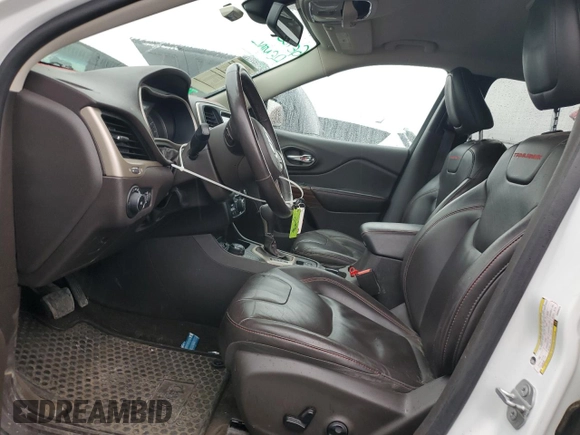 2015 Jeep Cherokee Trailhawk with VIN 1C4PJMBS9FW605075, listed as a Copart auction lot 49256195 with 103,677 mi miles and Salvage Title. Bid and sale history available at DreamBid. Image 7.