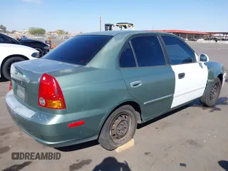2005 Hyundai Accent GLS with VIN KMHCG45C95U620716, listed as a IAAI auction lot 41740573 with 187,971 mi miles. Bid and sale history available at carsss.com. Image 4.