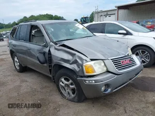 2007 GMC Envoy SLE with VIN 1GKDS13S272278285, listed as a IAAI auction lot 40006486 with 158,109 mi miles. Bid and sale history available at carsss.com. Image 1.
