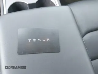 2023 Tesla Model 3 with VIN 5YJ3E1EA2PF566047, listed as a IAAI auction lot 42481008 with 21,143 mi miles and . Bid and sale history available at DreamBid. Image 11.