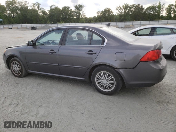 2009 Kia Optima LX z VIN KNAGE228695331919, wystawiony jako Copart lot #57804835 z przebiegiem 199 204 mil mil oraz Szkoda całkowita • Salvage title. Historia ofert i sprzedaży dostępna na DreamBid. Obrazek 2.