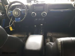 2012 Jeep Wrangler Unlimited Sahara with VIN 1C4BJWEG5CL281584, listed as a Copart auction lot 50982655 with 132,548 mi miles and Salvage Title. Bid and sale history available at carsss.com. Image 8.