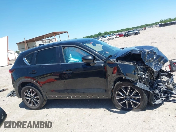 2018 Mazda CX-5 Touring z VIN JM3KFACM3J1339074, wystawiony jako IAAI lot #42317039 z przebiegiem 82 799 mil mil oraz . Historia ofert i sprzedaży dostępna na DreamBid. Obrazek 14.