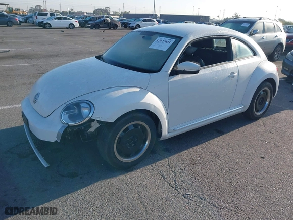 2012 Volkswagen Beetle 2.5L PZEV with VIN 3VWJP7AT3CM664552, listed as a IAAI auction lot 42077635 with 96,195 mi miles. Bid and sale history available at carsss.com. Image 2.