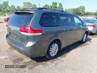 2014 Toyota Sienna XLE with VIN 5TDYK3DC6ES414892, listed as a IAAI auction lot 42545666 with 135,805 mi miles and . Bid and sale history available at DreamBid. Image 4.
