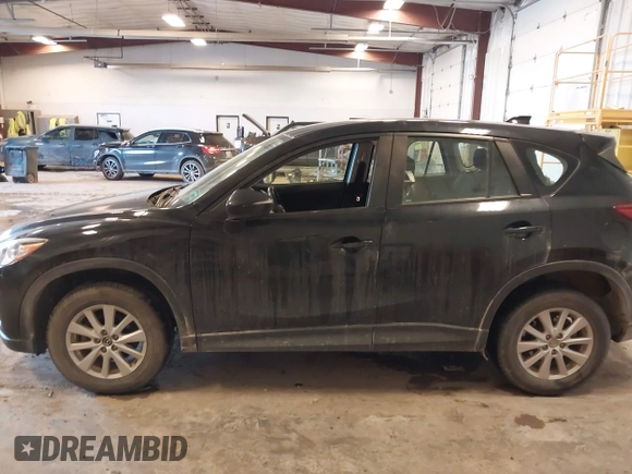 2015 Mazda CX-5 Sport with VIN JM3KE4BY0F0542655, listed as a IAAI auction lot 41471568 with 165,386 mi miles. Bid and sale history available at carsss.com. Image 14.