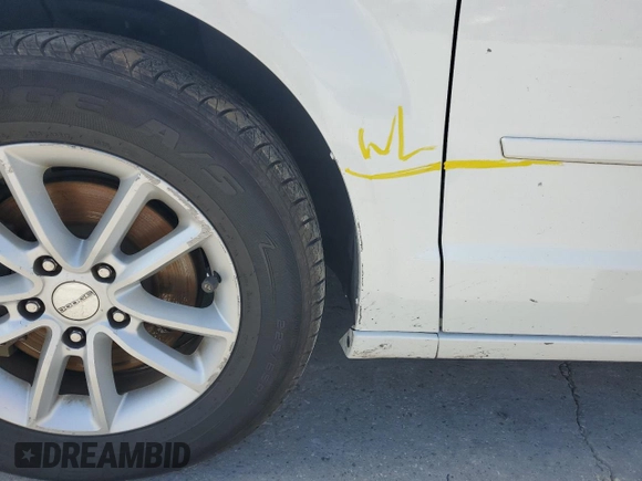 2014 Dodge Grand Caravan SXT z VIN 2C4RDGCG8ER428893, wystawiony jako Copart lot #56671355 z przebiegiem 261 815 mil mil oraz Szkoda całkowita • Salvage title. Historia ofert i sprzedaży dostępna na DreamBid. Obrazek 13.