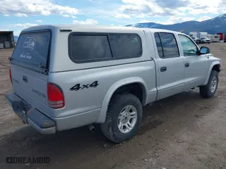 2003 Dodge Dakota Sport with VIN 1D7HG38N63S321703, listed as a IAAI auction lot 41807402 with 252,984 mi miles. Bid and sale history available at carsss.com. Image 4.