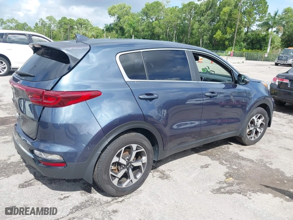 2020 Kia Sportage LX with VIN KNDPM3AC3L7713581, listed as a IAAI auction lot 40255286 with 90,221 mi miles. Bid and sale history available at carsss.com. Image 4.