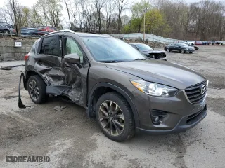 2016 Mazda CX-5 Grand Touring with VIN JM3KE4DY5G0848717, listed as a Copart auction lot 53249895 with 86,746 mi miles and Salvage Title. Bid and sale history available at carsss.com. Image 4.