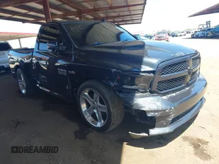 2015 Ram 1500 Sport z VIN 3C6JR6CT4FG698790, wystawiony jako IAAI lot #42182144 z przebiegiem 63 294 mil mil oraz . Historia ofert i sprzedaży dostępna na DreamBid. Obrazek 1.