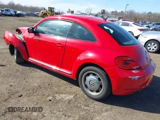2012 Volkswagen Beetle 2.5L PZEV with VIN 3VWJP7AT5CM631505, listed as a IAAI auction lot 41733955 with 35,519 mi miles. Bid and sale history available at carsss.com. Image 3.
