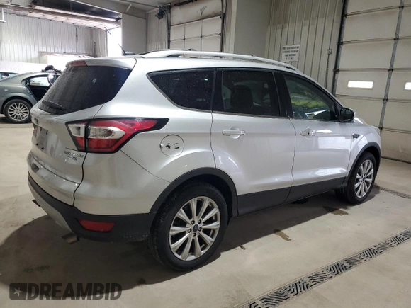 2017 Ford Escape Titanium with VIN 1FMCU9JD9HUC58945, listed as a Copart auction lot 52341485 with 31,074 mi miles and Salvage Title. Bid and sale history available at carsss.com. Image 3.