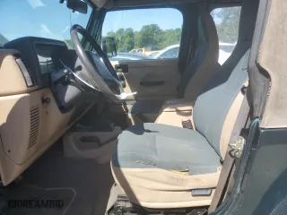 1999 Jeep Wrangler Sahara with VIN 1J4FY49S6XP478675, listed as a Copart auction lot 52147605 with 157,971 mi miles and Salvage Title. Bid and sale history available at carsss.com. Image 7.