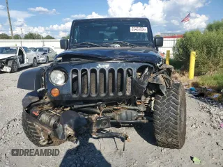2010 Jeep Wrangler Rubicon with VIN 1J4BA6D10AL109001, listed as a Copart auction lot 69453954 with 137,821 mi miles and Salvage title. Bid and sale history available at DreamBid. Image 5.