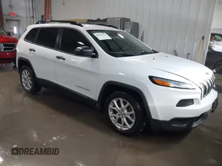 2016 Jeep Cherokee Sport z VIN 1C4PJLAB2GW291282, wystawiony jako IAAI lot #41579554 z przebiegiem 121 590 mil mil oraz . Historia ofert i sprzedaży dostępna na DreamBid. Obrazek 1.
