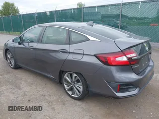 2018 Honda Clarity Touring z VIN JHMZC5F3XJC001054, wystawiony jako IAAI lot #42292688 z przebiegiem 60 780 mil mil oraz . Historia ofert i sprzedaży dostępna na DreamBid. Obrazek 3.
