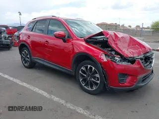 2016 Mazda CX-5 Grand Touring z VIN JM3KE4DY2G0903317, wystawiony jako IAAI lot #42218062 z przebiegiem 65 035 mil mil oraz . Historia ofert i sprzedaży dostępna na DreamBid. Obrazek 1.