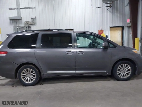 2012 Toyota Sienna XLE AAS with VIN 5TDYK3DC9CS268758, listed as a IAAI auction lot 41613513 with 214,601 mi miles. Bid and sale history available at carsss.com. Image 13.