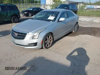 2015 Cadillac ATS Luxury RWD z VIN 1G6AB5RA6F0127029, wystawiony jako IAAI lot #42376359 z przebiegiem 131 823 mil mil oraz . Historia ofert i sprzedaży dostępna na DreamBid. Obrazek 2.