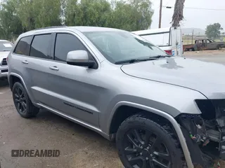 2017 Jeep Grand Cherokee Laredo with VIN 1C4RJEAG0HC702195, listed as a IAAI auction lot 42427597 with 104,403 mi miles and . Bid and sale history available at DreamBid. Image 14.