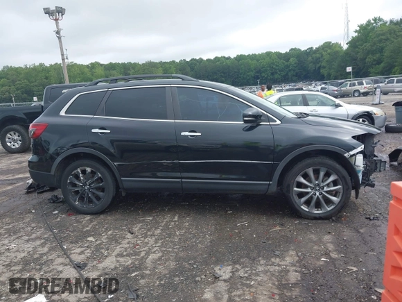 2015 Mazda CX-9 Grand Touring with VIN JM3TB2DA1F0464517, listed as a IAAI auction lot 42484985 with 104,932 mi miles and . Bid and sale history available at DreamBid. Image 14.