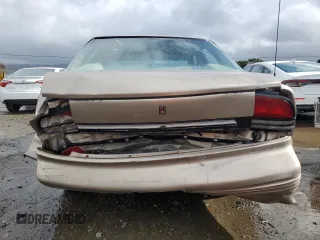 1996 Oldsmobile Cutlass Supreme S z VIN 1G3WH52M1TF334801, wystawiony jako Copart lot #44814585 z przebiegiem 106 295 mil mil oraz Szkody całkowita. Historia ofert i sprzedaży dostępna na DreamBid. Obrazek 6.