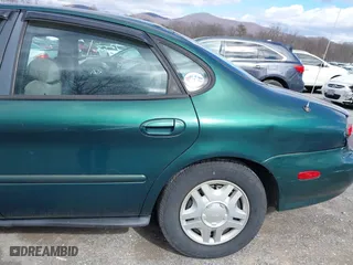 1999 Ford Taurus SE with VIN 1FAFP53S5XA102534, listed as a IAAI auction lot 41740212 with 154,926 mi miles. Bid and sale history available at carsss.com. Image 13.