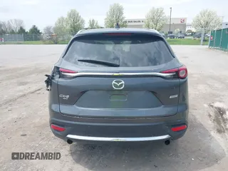2016 Mazda CX-9 Grand Touring with VIN JM3TCBDY3G0117802, listed as a IAAI auction lot 42150821 with 157,760 mi miles and . Bid and sale history available at DreamBid. Image 16.
