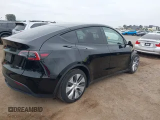 2023 Tesla Model Y Long Range with VIN 7SAYGDEEXPA044335, listed as a IAAI auction lot 42350159 with 26,731 mi miles and . Bid and sale history available at DreamBid. Image 4.