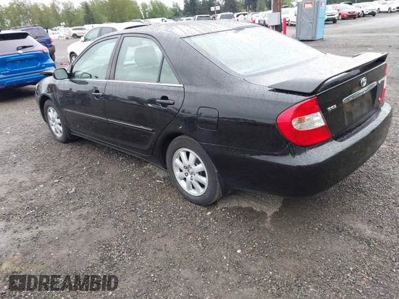2003 Toyota Camry LE z VIN 4T1BF30KX3U049919, wystawiony jako IAAI lot #42148543 z przebiegiem 208 140 mil mil oraz . Historia ofert i sprzedaży dostępna na DreamBid. Obrazek 3.