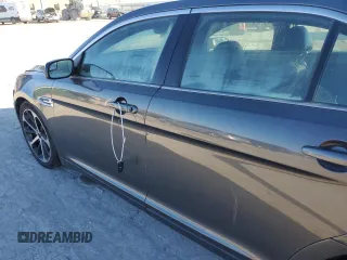 2015 Ford Taurus SEL with VIN 1FAHP2E99FG193966, listed as a Copart auction lot 82333044 with Not Provided miles and Salvage Title. Bid and sale history available at DreamBid. Image 7.